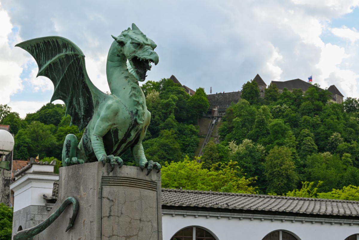Looking up at Ljubljana castle from the Dragon Bridge.